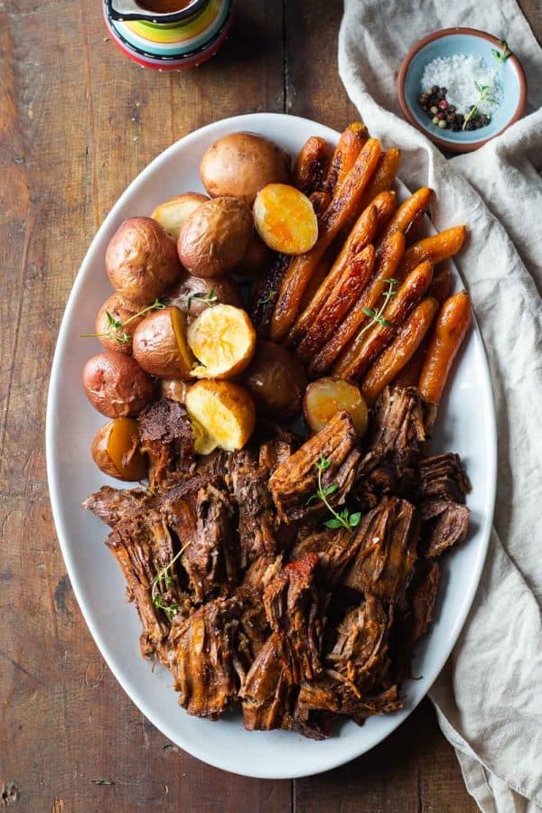 Pot Roast with Potatoes and Carrots made in the Instant Pot served on a white serving plate