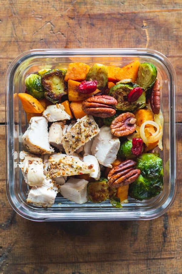 One Maple Dijon Chicken Meal Prep Bowl on a wooden table.