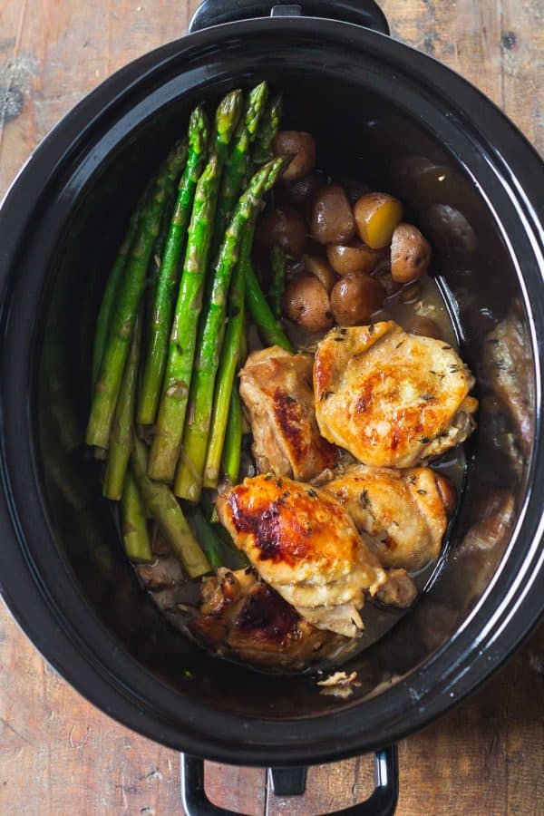 slow cooker lemon chicken cooking in a crockpot