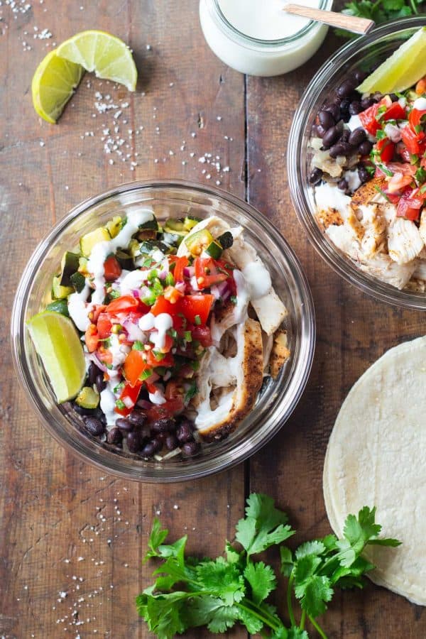 Mexican Chicken, Zucchini, Black Beans, Pico de Gallo in a round glass meal prep bowl.