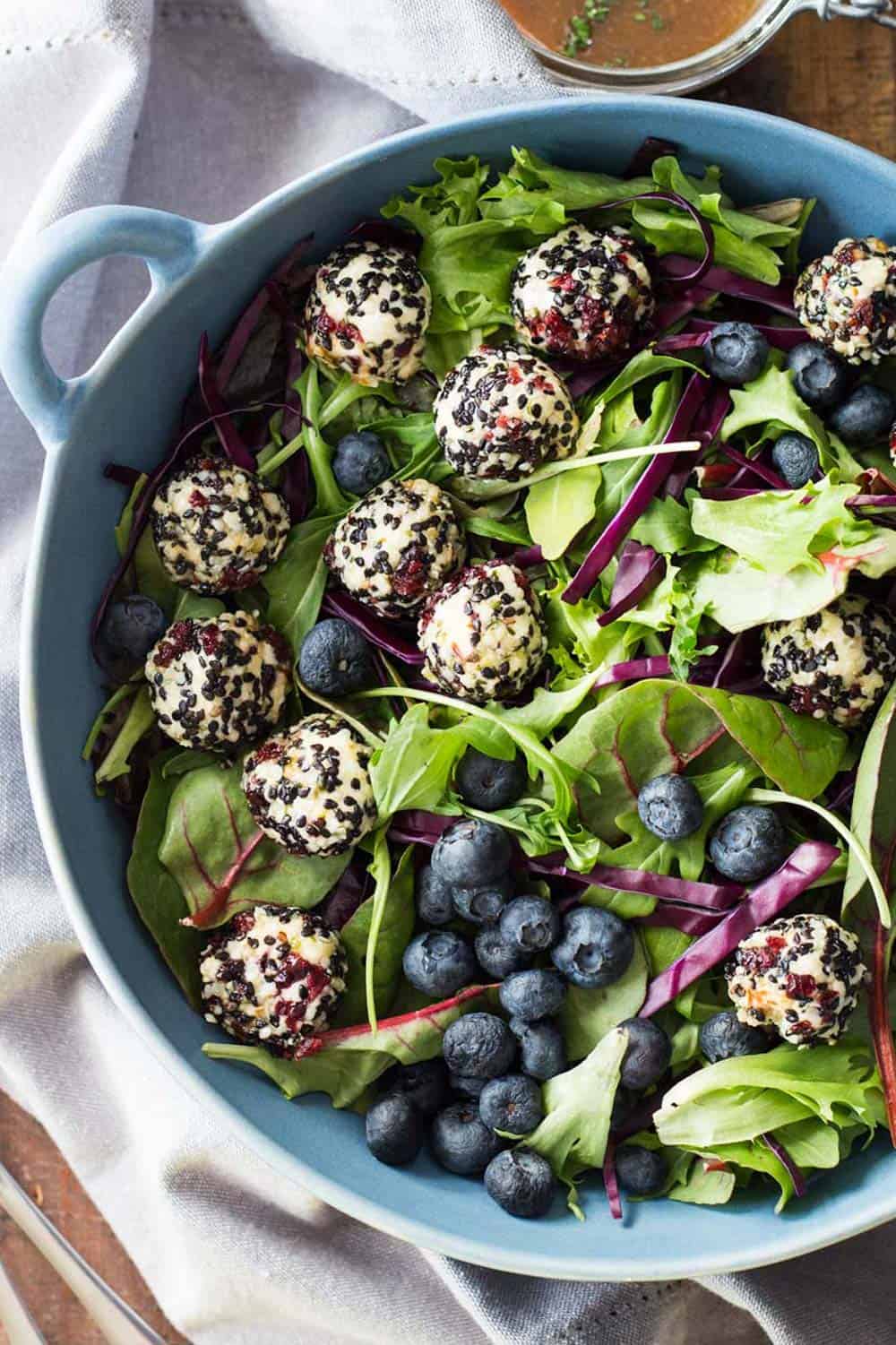 Warm Goat Cheese Salad in blue salad bowl