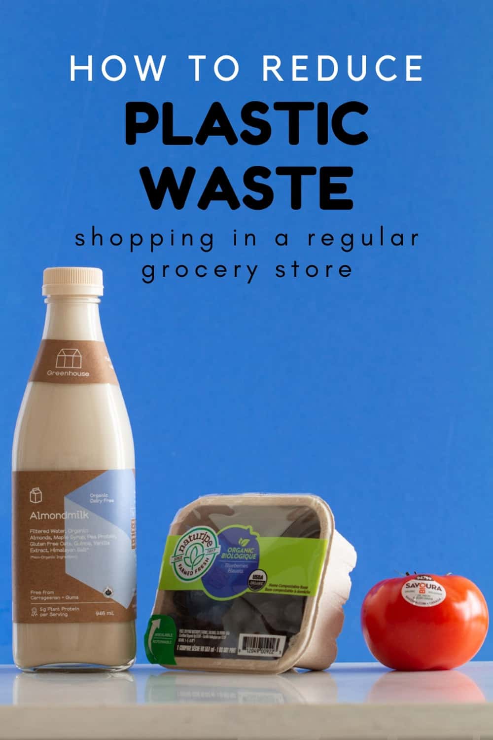 Glass Bottle with Almond Milk, Cardboard Box with Blueberries, Tomato with Sticker