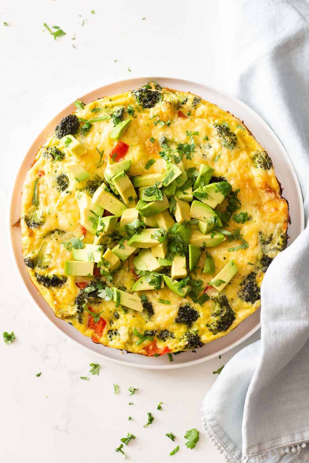 Whole vegetable frittata on a plate.