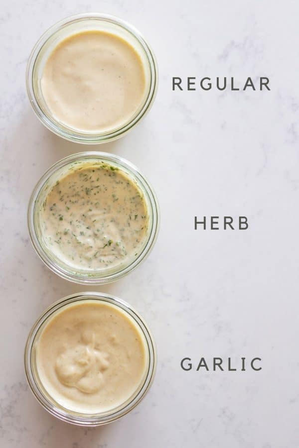 Regular homemade mayonnaise, herb mayonnaise, garlic mayonnaise in jars