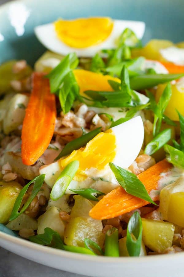 warm farro salad with hard boiled eggs and roasted vegetables