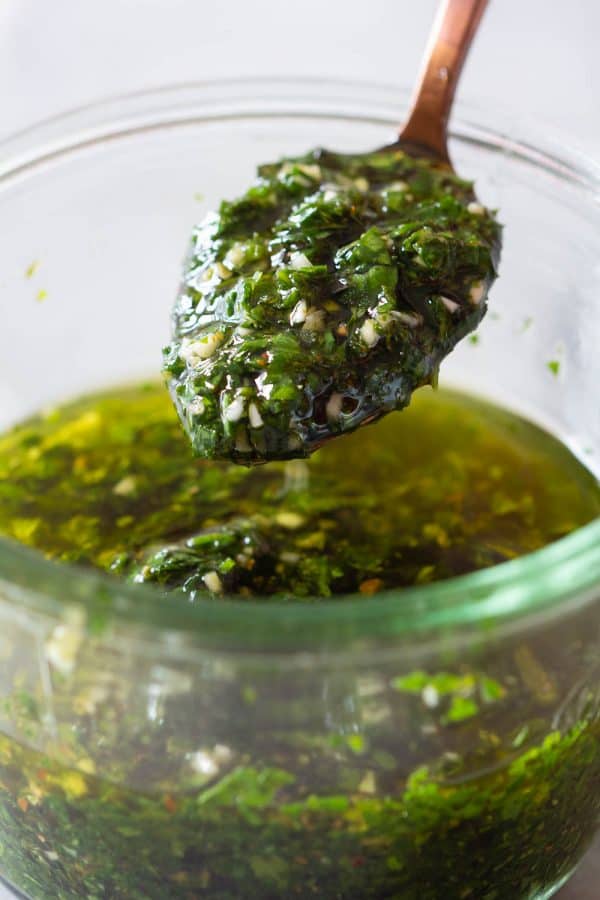 Chimichurri on a spoon and in a jar