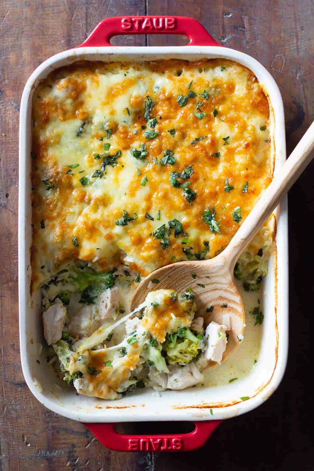 Chicken and Rice Casserole with a wooden spoon