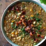 Crockpot Lentil Soup in a blue bowl topped with bacon