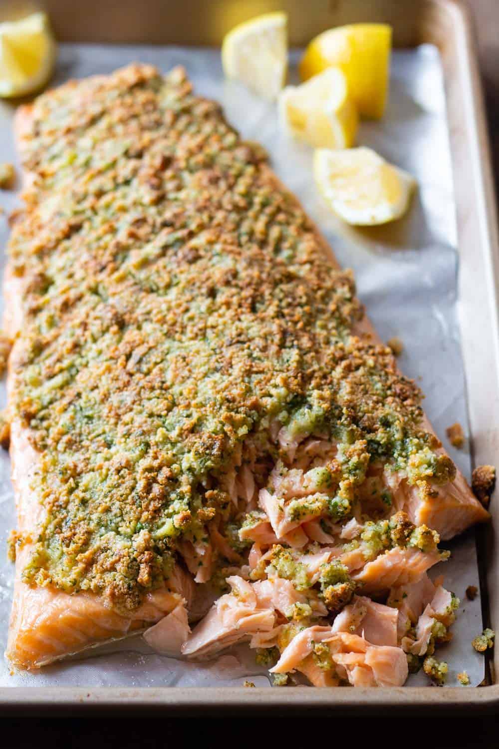 Almond curst baked salmon fillet on a baking sheet