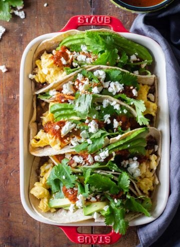Breakfast Tacos lined up in a baking dish