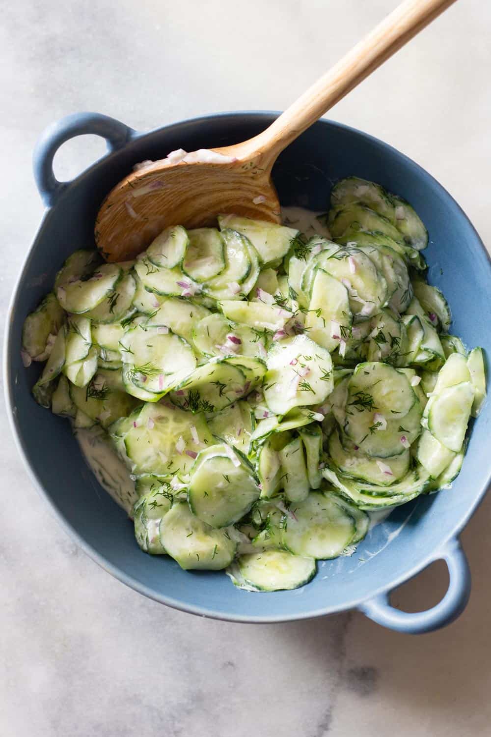 Creamy Cucumber Salad in a blue salad bowl