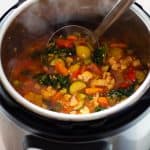 Vegetable Soup in an Instant Pot with a ladle in it