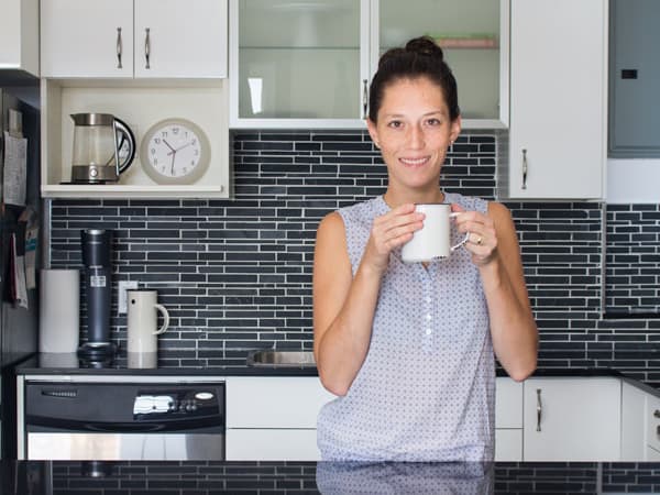 Lorena with a cup of coffee in hands