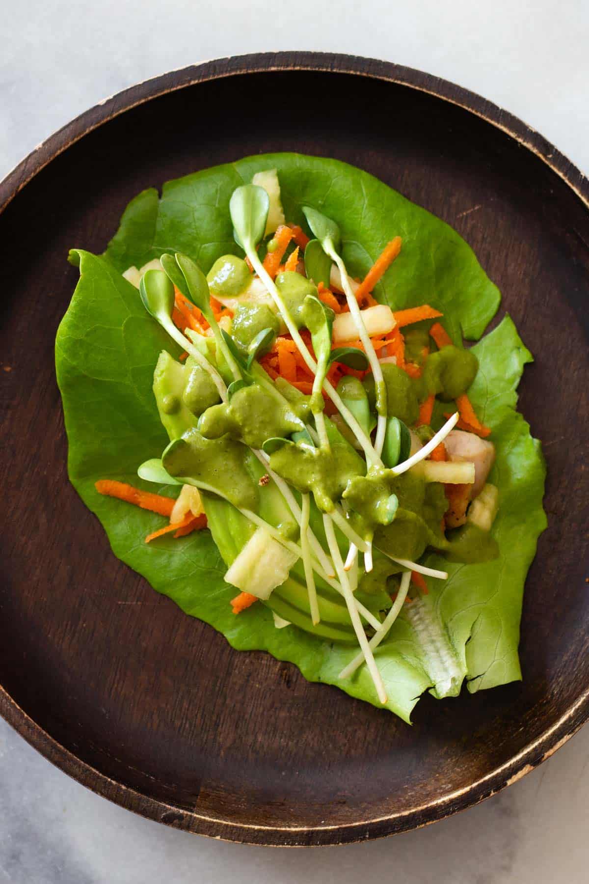 Chicken Lettuce Wrap on a wooden plate