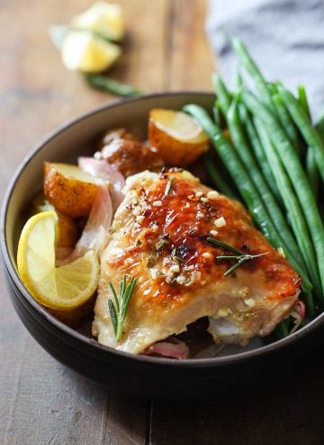 Rosemary Lemon Chicken with green beans and baby potatoes in a bowl.