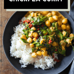 Coconut chickpea curry in a bowl and text overlay of recipe title for pinterest.
