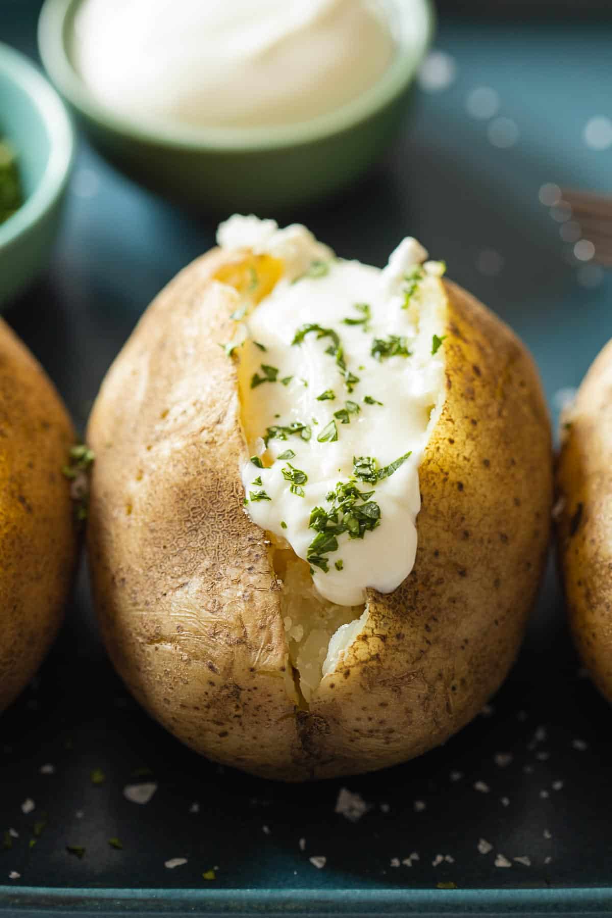 https://greenhealthycooking.com/wp-content/uploads/2021/03/Instant-Pot-Baked-Potatoes-Closeup.jpg