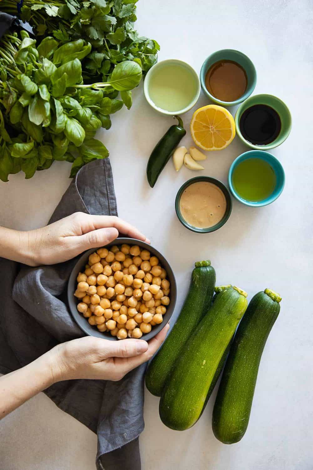 Zucchini Noodle Ingredients all laid out on a kitchen counter.