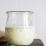 Greek Yogurt Herb Dressing in a glass jar.