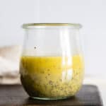 Lemon Poppy Seed Salad Dressing in a small glass jar.