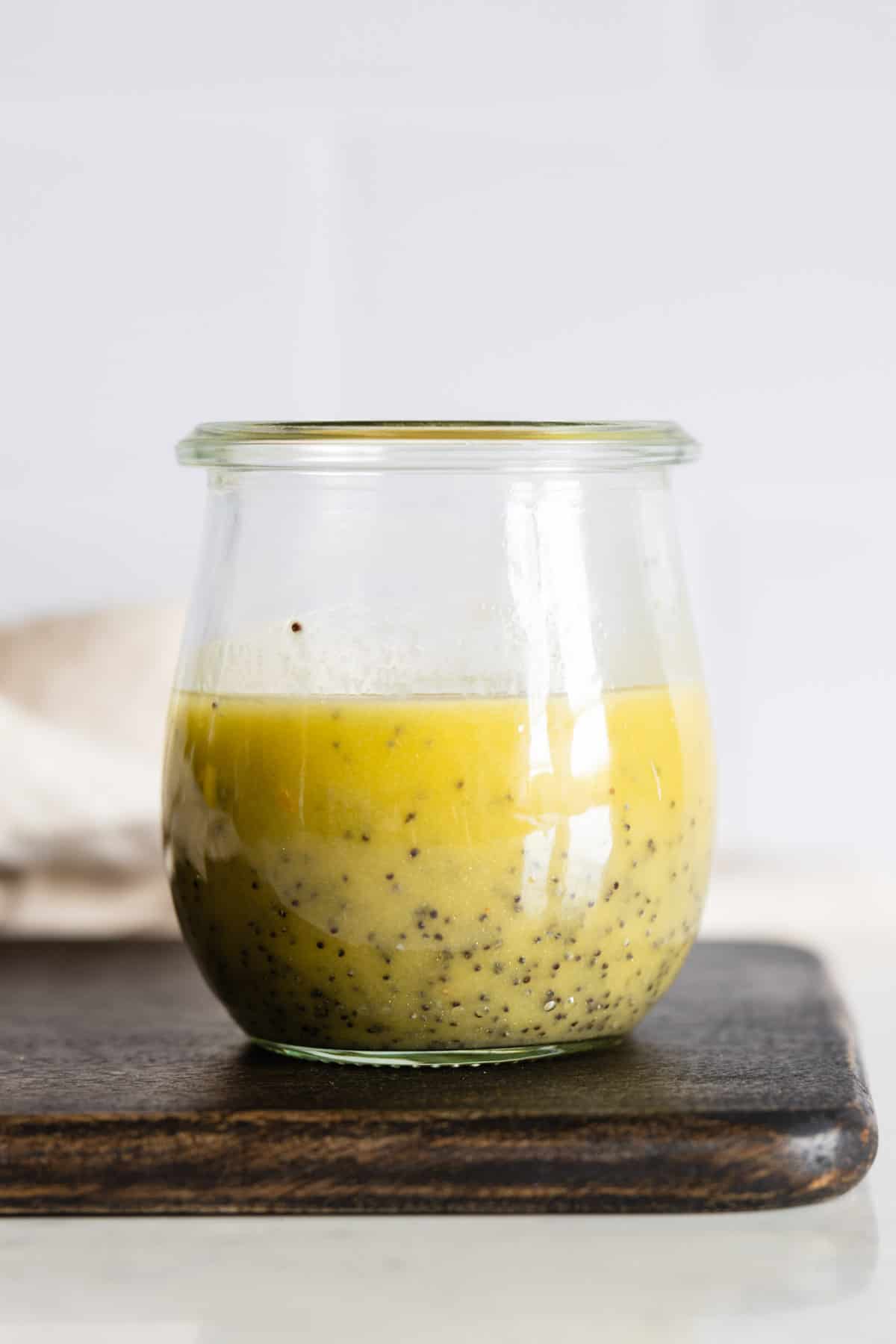 Lemon Poppy Seed Salad Dressing in a small glass jar.