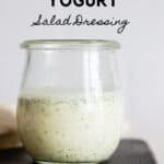 Glass jar with white salad dressing with title reading: Greek Yogurt Salad Dressing.