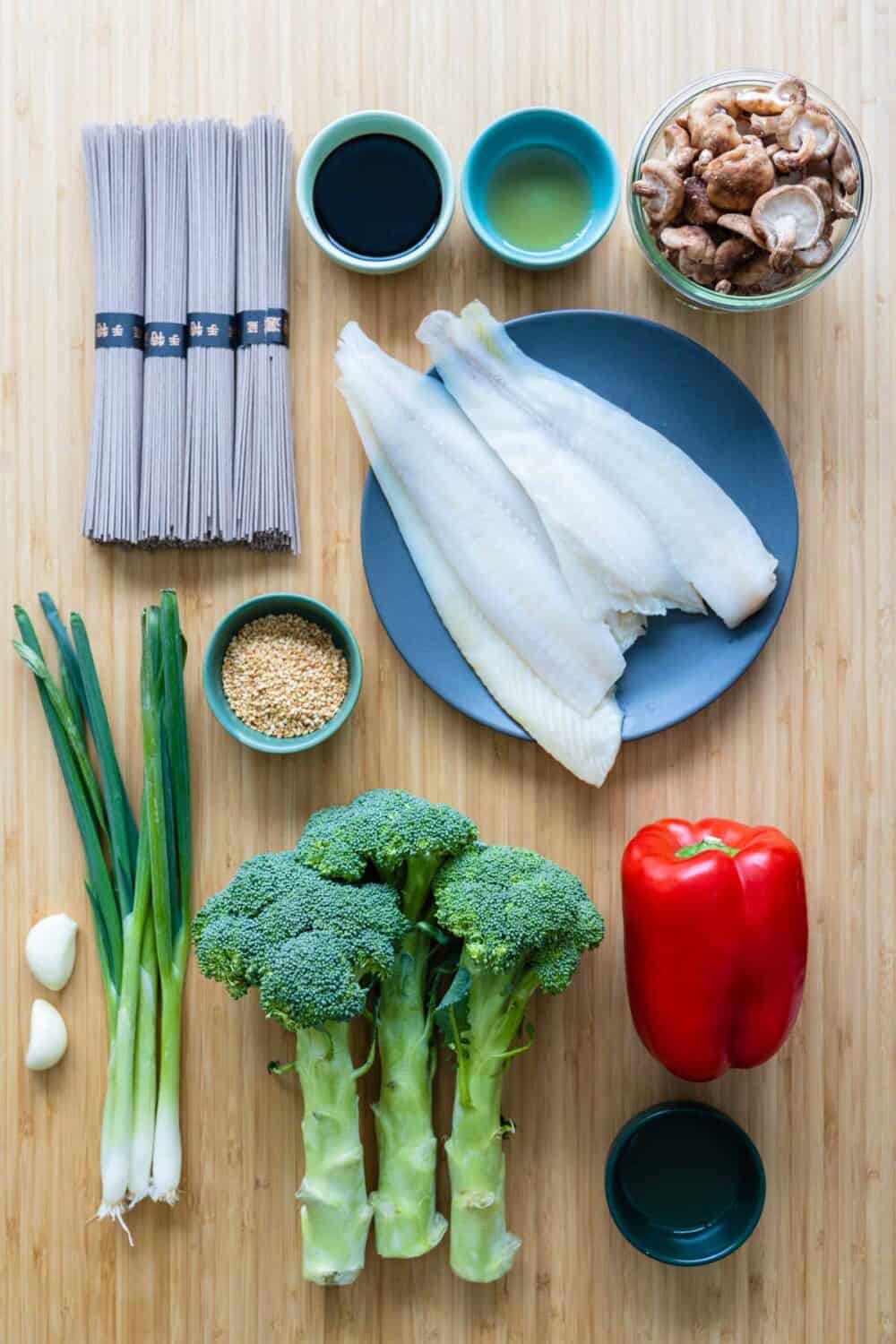 Ingredients for soba noodles stir-fry laid out on a kitchen counter.
