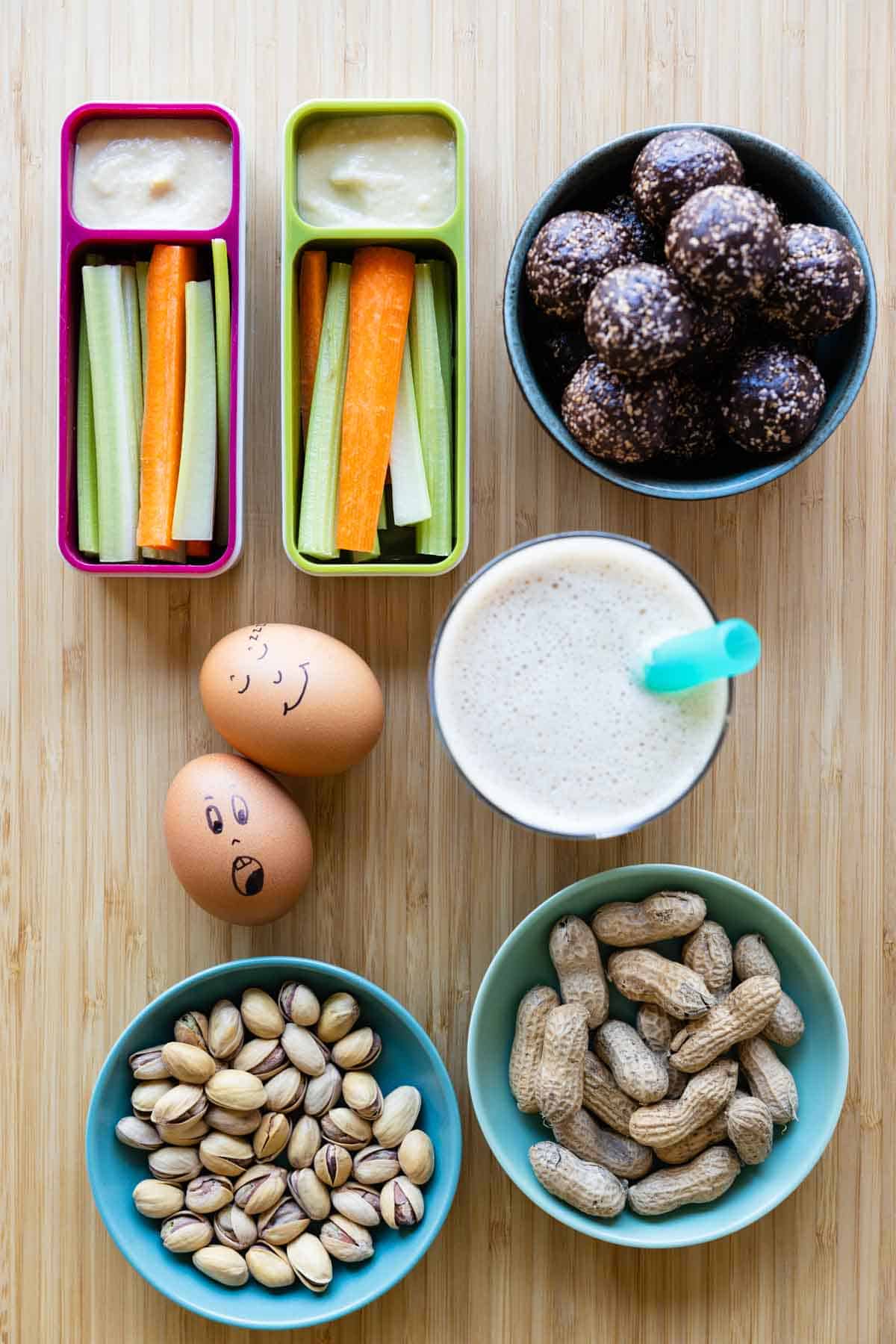 after-school snacks in bowls and containers laid out on a kitchen counter.