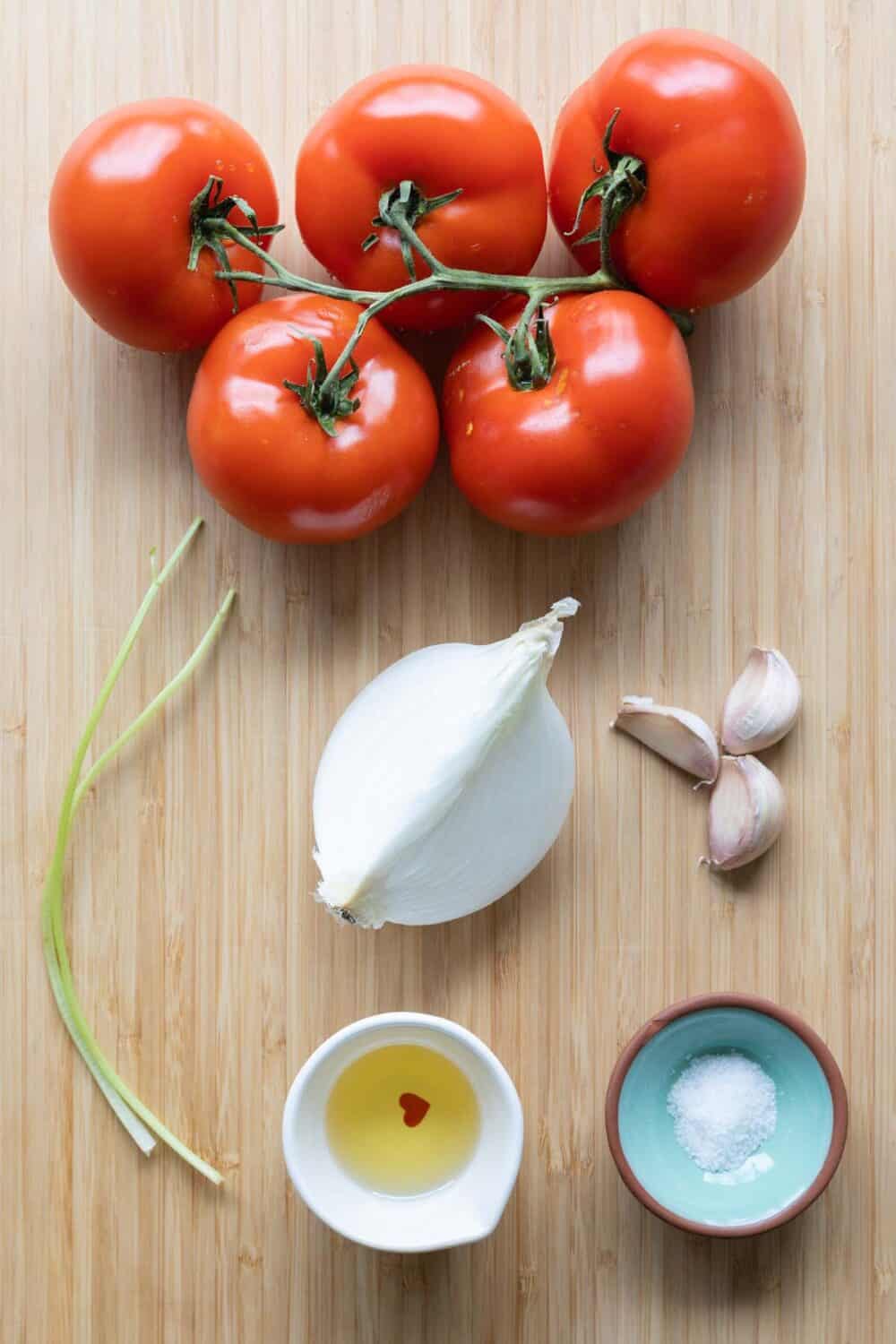 ingredients for salsa roja laid out on a kitchen counter.