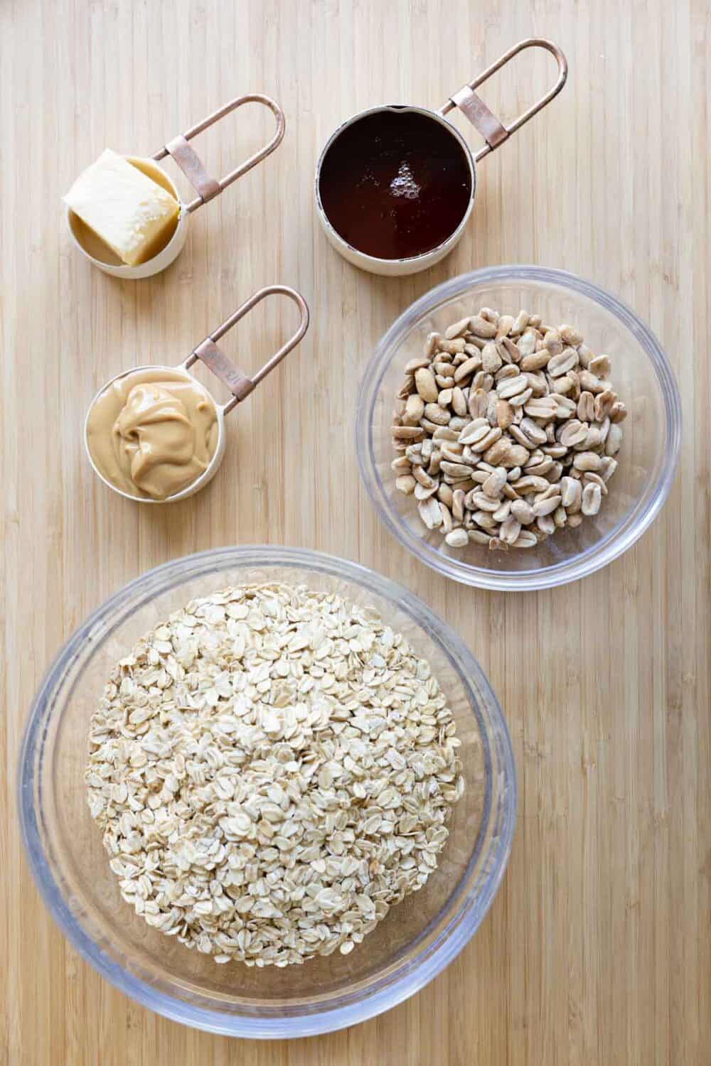 Ingredients for Peanut Butter Granola laid out on a kitchen counter.