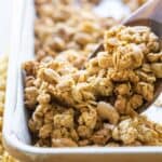 Close-up of baked peanut butter granola on a baking sheet.