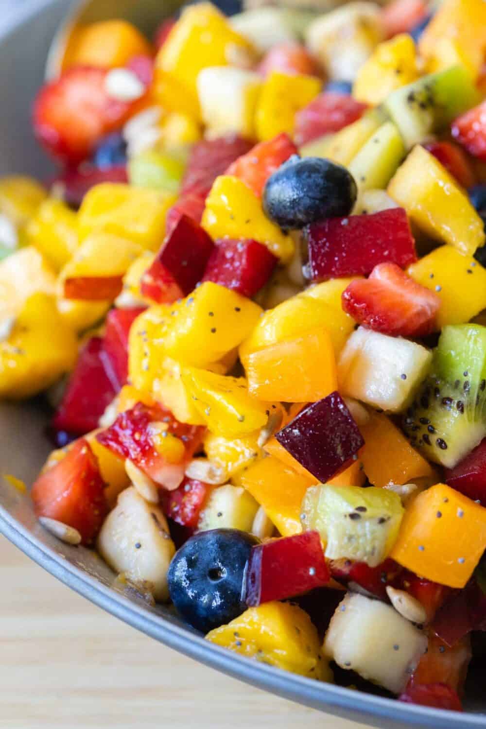 Closeup image of mixed up fruit salad.