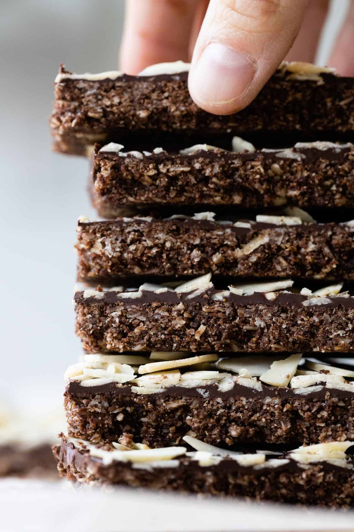 6 Almond Granola Bars stacked one on top of the other.