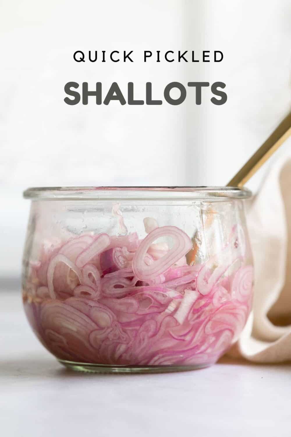 Sliced shallots in a glass jar and text overlay reading: Quick Pickled Shallots.