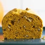 Closeup showing texture of cut open pumpkin bread.