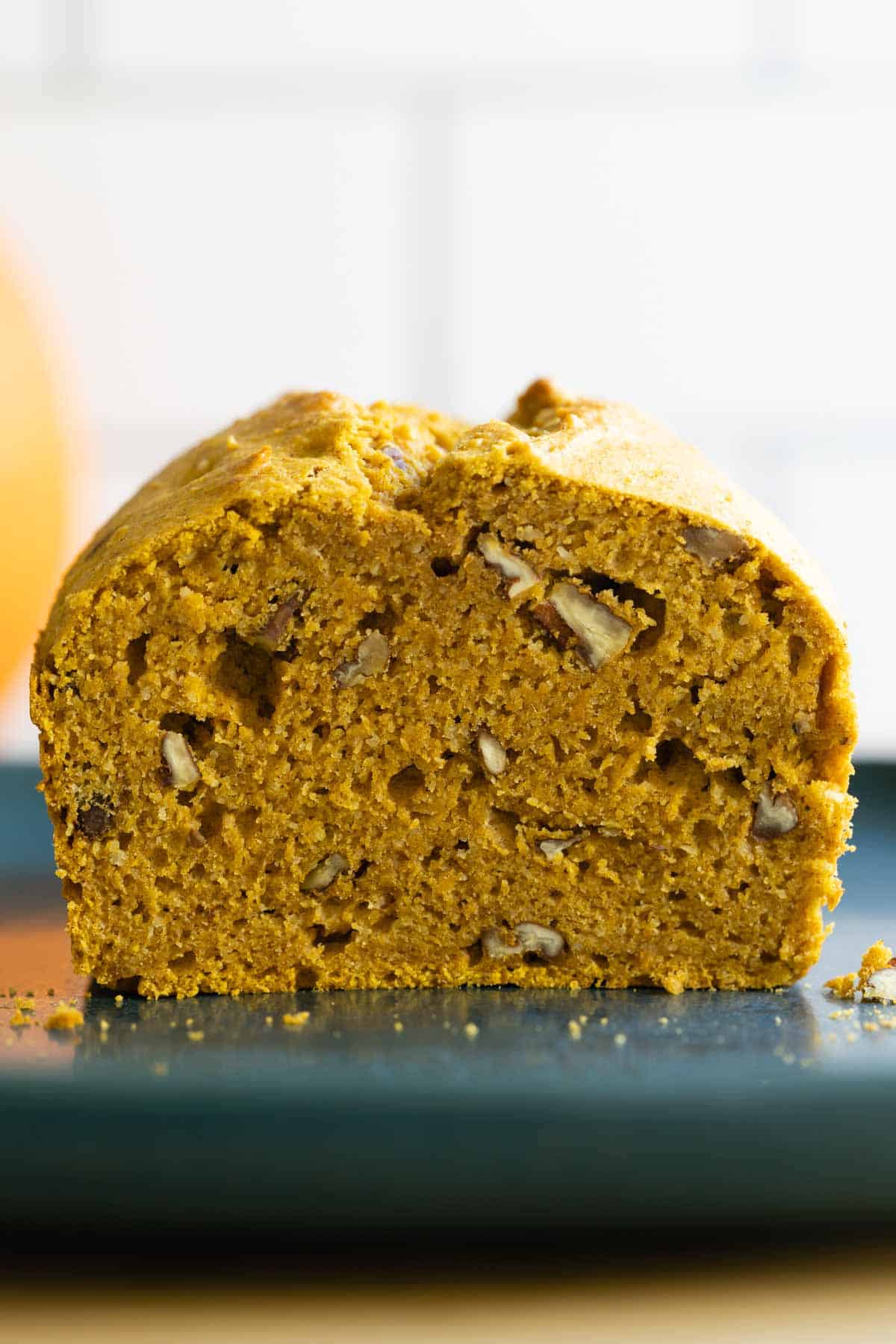 Closeup showing texture of cut open pumpkin bread.