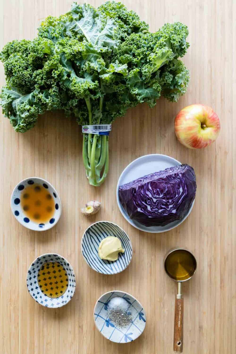 Ingredients for simple kale salad laid out on a kitchen counter.