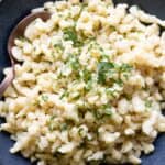 German Spaetzle served in a blue bowl.