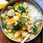 Instant Pot Chicken Stew served over rice in a bowl.