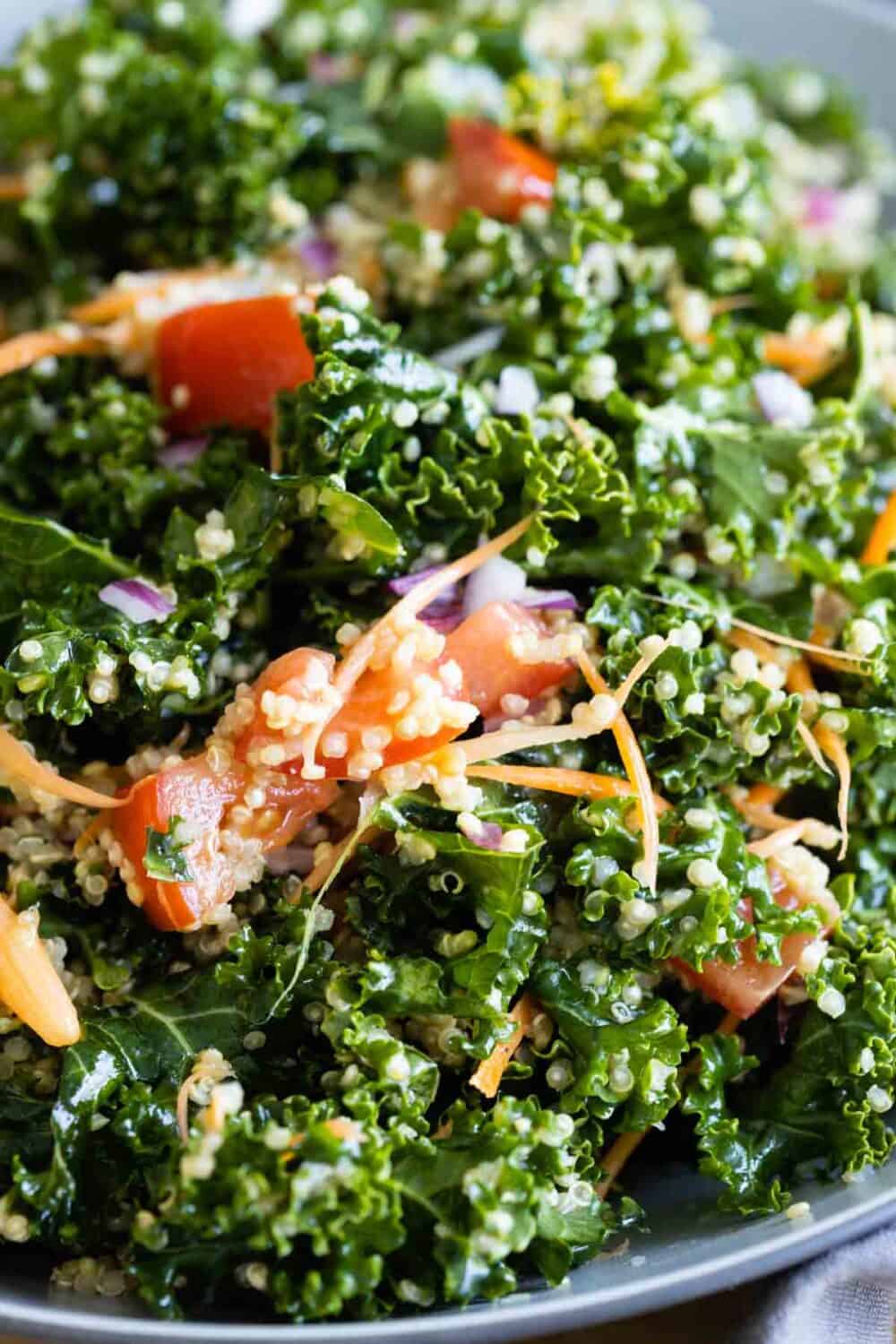 Closeup texture of dressed and tossed Kale Quino Salad.