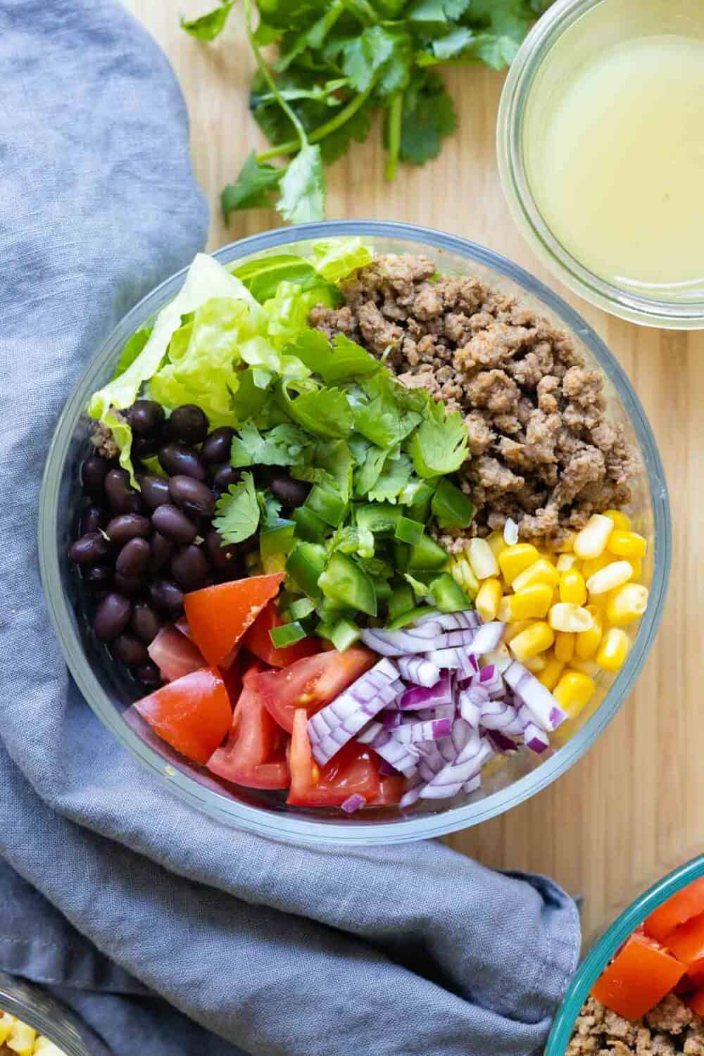 Close up shot of the individual ingredients inside a glass bowl.