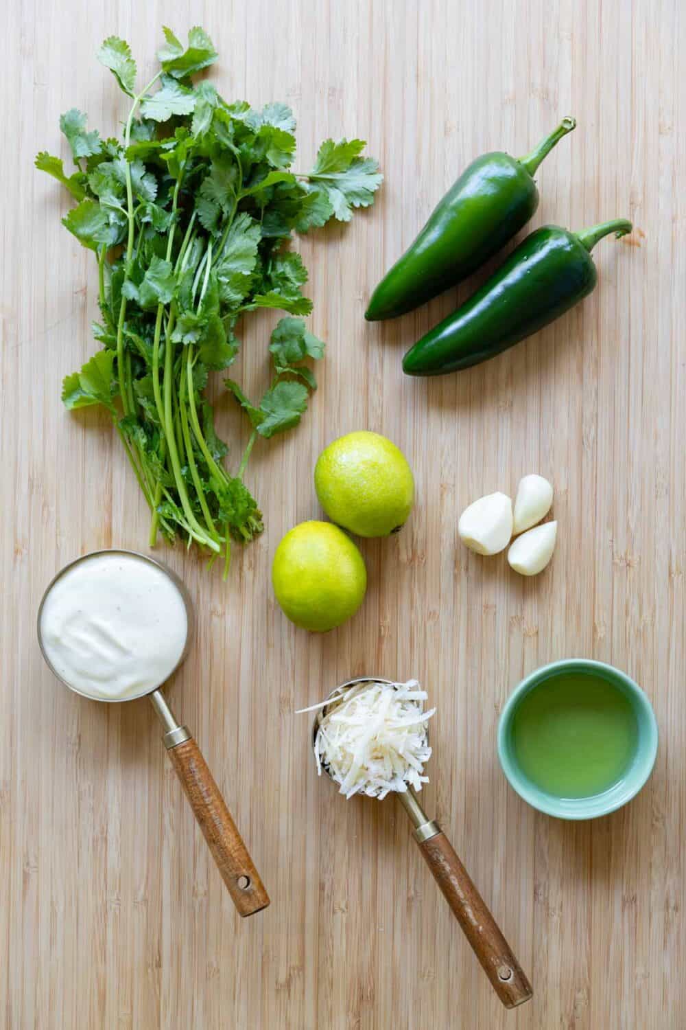 Ingredients for ají verde sauce laid out on a kitchen counter.