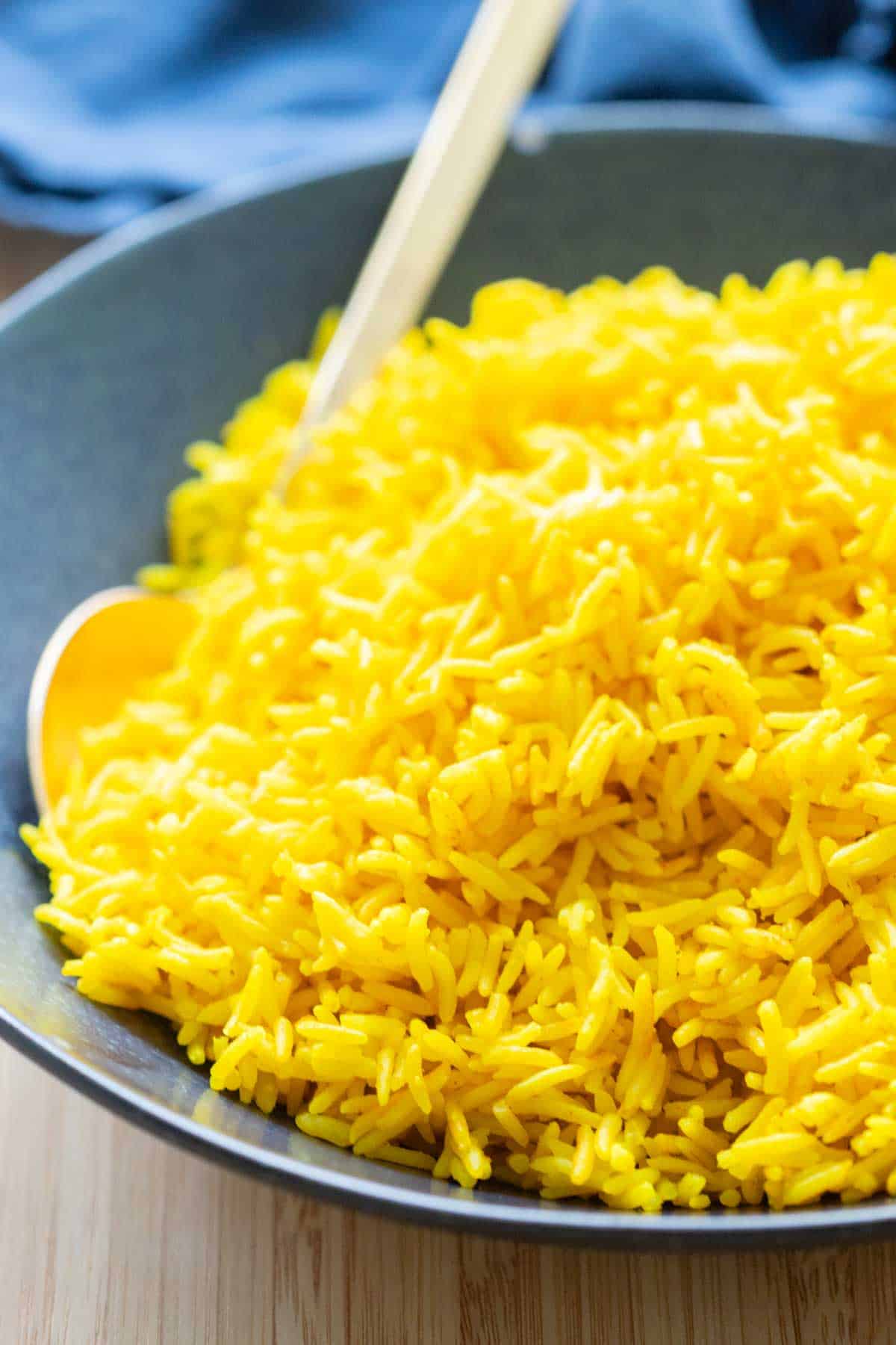 Yellow Rice in a blue bowl.