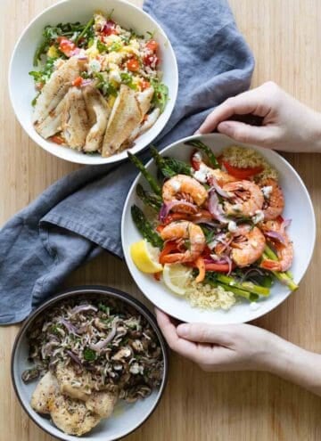Three serving bowls filled each with a different 30-minute dinner recipe.